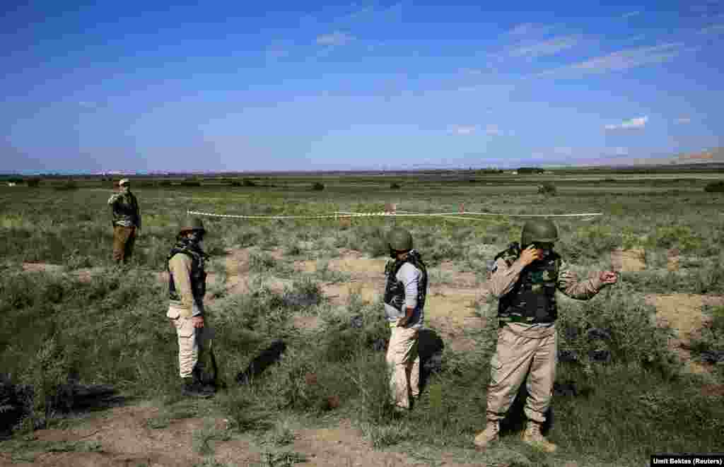 A bomb squad secures unexploded submunitions from a cluster bomb that hit a remote area of Azerbaijan near the Baku-Tbilisi-Ceyhan (BTC) crude oil pipeline. The BTC pipeline is a 1,768-kilometer-long conduit, operated by BP, that exports millions of barrels of Azerbaijani, Kazakh, and Turkmen crude to foreign markets via Georgia and Turkey.&nbsp; &nbsp;