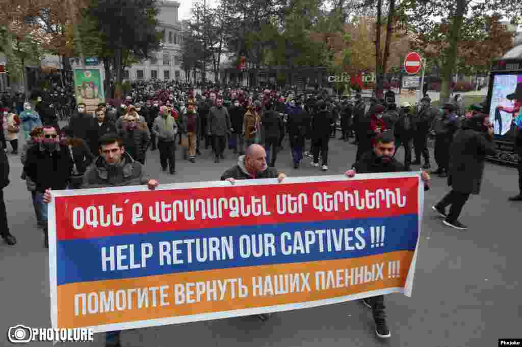 Armenian intellectuals march to the Russian Embassy in Yerevan on November 29, 2020 to demand Russia's help in locating missing Armenian soldiers and to call for Azerbaijan to return all prisoners. Petitions also have been made to the French and U.S. embassies. Ordinary Azerbaijanis also have been struggling to receive information from their defense ministry about the status of missing relatives.&nbsp; Russian Foreign Minister Sergei Lavrov has underlined that Russian peacekeepers are assigned to facilitate the exchange of bodies and prisoners, but noted on December 1, 2020 the need for an exact list of who is missing. &nbsp;