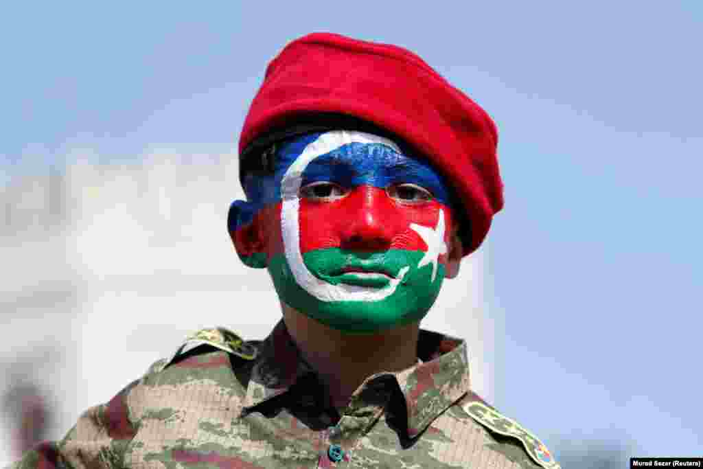 With his face painted in the colors of the Azerbaijani flag, Yusuf, a 6-year-old boy from Azerbaijan, takes part in a protest against Armenia in Istanbul, Turkey on October 4, 2020.&nbsp; Turkey, Azerbaijan's cultural kin and closest strategic partner, has supported Baku's calls for the withdrawal of Armenian troops from Nagorno-Karabakh and seven surrounding Azerbaijani regions.&nbsp;
