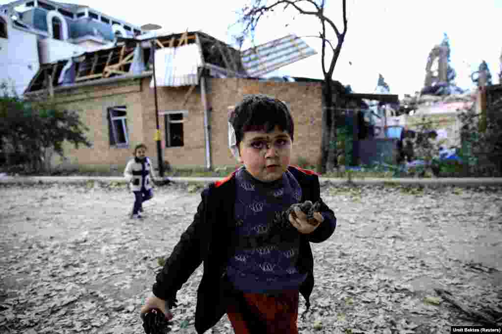Five-year-old Bahtiyar Elnur, who was injured during a blast, plays with his sister, Sehla, in the Azerbaijani city of Ganja on October 11, 2020.