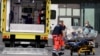 Paramedics load a stretcher into an ambulance that is believed to have transported Russian opposition leader Aleksei Navalny to the Charite -- Universitatsmedizin hospital in Berlin on August 22, 2020. 